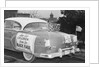 Automobile Decorated with Signs and American Flags by Anonymous