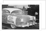 Automobile Decorated with Signs and American Flags by Anonymous
