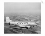 Douglas DC-3 Plane in Flight by Anonymous