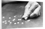 Hand Holding Pills Containing Thalidomide by Anonymous