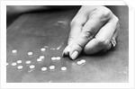Hand Holding Pills Containing Thalidomide by Anonymous