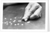 Hand Holding Pills Containing Thalidomide by Anonymous