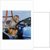 Johnny Rhesus Driving Tractor by Anonymous