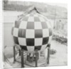 Checkered Steel Sphere Resting on Platform by Anonymous