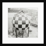 Checkered Steel Sphere Resting on Platform by Anonymous