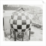 Checkered Steel Sphere Resting on Platform by Anonymous