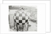 Checkered Steel Sphere Resting on Platform by Anonymous