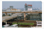 View of Downtown Tokyo with Railroad Yard in Foreground by Anonymous