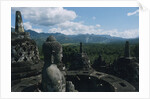 Statue of Buddha Sitting in a Stupa on Candi Borobudur by Anonymous