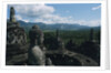 Statue of Buddha Sitting in a Stupa on Candi Borobudur by Anonymous