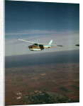 Cessna 210 Centurion Flying by Anonymous