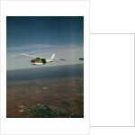 Cessna 210 Centurion Flying by Anonymous