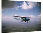 Cessna 182 Flying by Anonymous