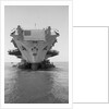 Tugboats Pushing the Aircraft Carrier John F. Kennedy by Corbis