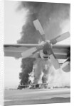 Flames and Smoke Rising from C-130s by Anonymous