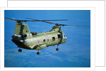 Military Helicopter Flying in Blue Skies by Anonymous