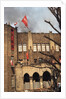 Student Waving Flag from Top of Building by Anonymous