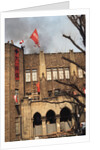 Student Waving Flag from Top of Building by Anonymous