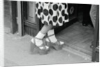Woman Wearing High Platform Shoes by Anonymous
