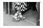 Woman Wearing High Platform Shoes by Anonymous