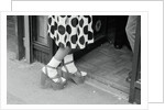 Woman Wearing High Platform Shoes by Anonymous