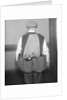 Man Wearing Coat Holding Bottles by Anonymous