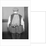 Man Wearing Coat Holding Bottles by Anonymous
