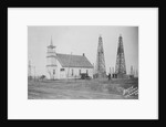 Oil Well Construction Behind Church by Anonymous