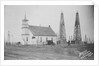 Oil Well Construction Behind Church by Anonymous