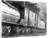 Steam Railroad Running Along Tracks by Anonymous