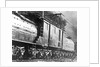 Steam Railroad Running Along Tracks by Anonymous