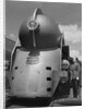 Inventor Standing by His Train Model by Anonymous