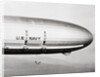 Plane Underneath Huge Dirigible in Flight by Anonymous