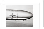 Plane Underneath Huge Dirigible in Flight by Anonymous