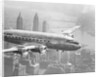 Aircraft Flying over City by Anonymous
