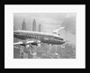 Aircraft Flying over City by Anonymous