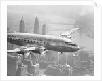 Aircraft Flying over City by Anonymous