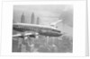 Aircraft Flying over City by Anonymous