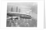 Aircraft Flying over City by Anonymous