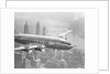 Aircraft Flying over City by Anonymous