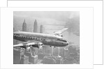 Aircraft Flying over City by Anonymous
