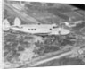 Howard Hughes Lockheed 14 Super Electra over Worlds Fair Site by Anonymous