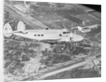 Howard Hughes Lockheed 14 Super Electra over Worlds Fair Site by Anonymous