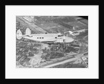 Howard Hughes Lockheed 14 Super Electra over Worlds Fair Site by Anonymous
