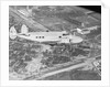 Howard Hughes Lockheed 14 Super Electra over Worlds Fair Site by Anonymous