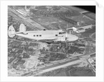 Howard Hughes Lockheed 14 Super Electra over Worlds Fair Site by Anonymous