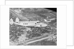 Howard Hughes Lockheed 14 Super Electra over Worlds Fair Site by Anonymous
