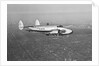 Howard Hughes' Lockheed 14 Super Electra over New York City by Anonymous