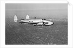 Howard Hughes' Lockheed 14 Super Electra over New York City by Anonymous
