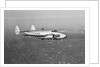 Howard Hughes' Lockheed 14 Super Electra over New York City by Anonymous